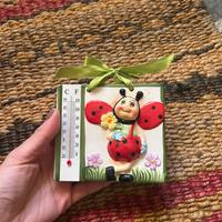 Formella con coccinella