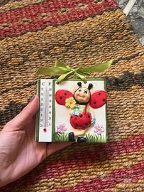 Formella con coccinella