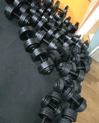 Pesi manubri regolabili palestra ciclette tappeto