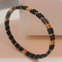 Bracciale rigido unisex, oro giallo 18Kt e Ematite