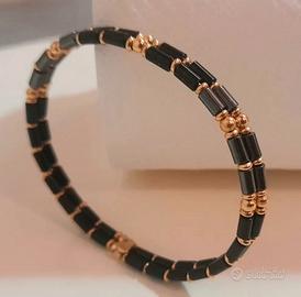 Bracciale rigido unisex, oro giallo 18Kt e Ematite