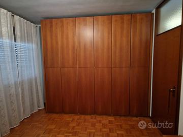 Armadio 12 ante in noce massello