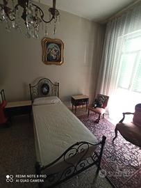 Letto singolo in ferro battuto