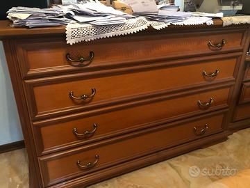 Stanza in noce con struttura letto