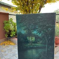 Casa sul fiume con due alberi, notturna