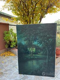 Casa sul fiume con due alberi, notturna