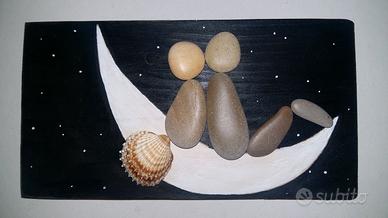 quadretto realizzato con sassi , innamorati
