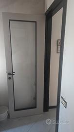 Porta interna moderna con vetro con telaio 