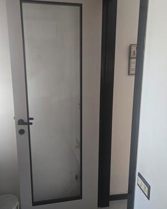 Porta interna moderna con vetro con telaio 
