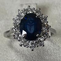ANELLO ORO 18kt. CON DIAMANTI E ZAFFIRO BLU OVALE