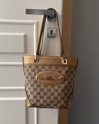 Borsa Gucci in pelle metallizzata bronzo e canvas
