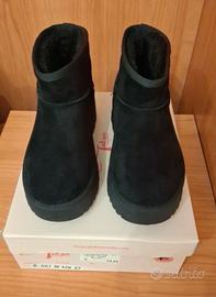 Stivaletto finta pelliccia platform 