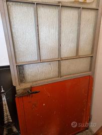 Porta in ferro semi vetrata
