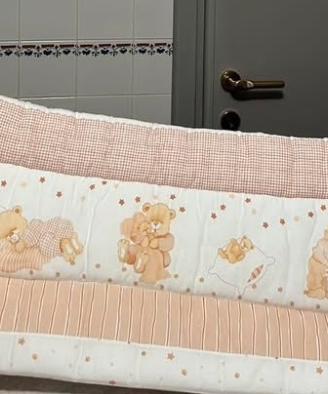 Paracolpi e piumino lettino