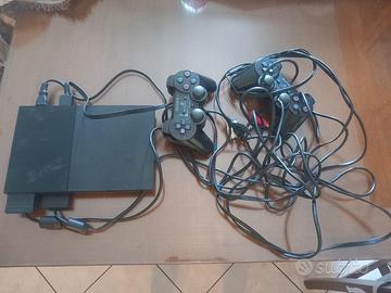 play station 2 con 2 joystick e 3 videogiochi