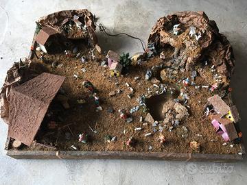 Presepio con statuine, casette e luci