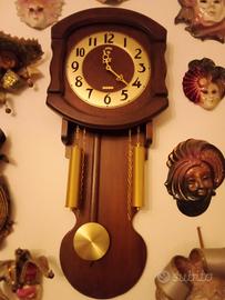 orologio da parete con pendolo 