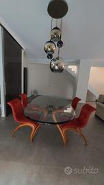 Tavolo in cristallo con sedie