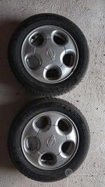 4 cerchi nissan R13 con 4 pleomatici nuovi 