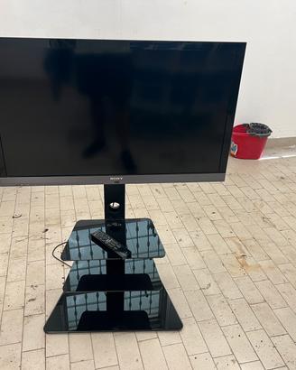 Televisore più supporto con mensole