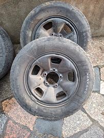 cinque cerchioni in ferro con gomme