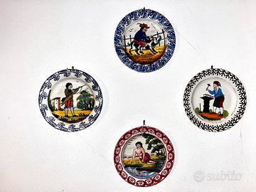 Quattro piatti antichi decorati a mano