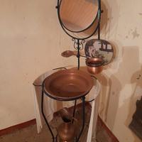 Lavabo in ferro battuto con accessori in rame