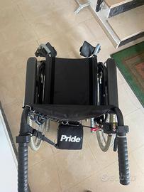 Sedia a rotelle con motore elettrico