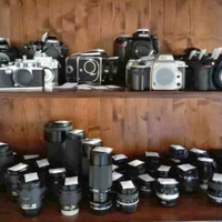 Macchine fotografiche obiettivi tracolla