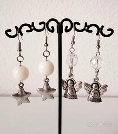 Coppia di orecchini stella e angelo