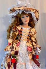 Bambola di porcellana con piedistallo