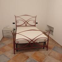 letto in ferro battuto con materasso in lattice