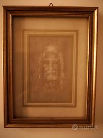 Quadro con volto della Sacra Sindone e libretto