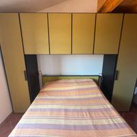 Armadio a ponte con struttura letto