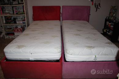 Due letti contenitore di colore rosso e rosa