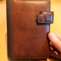 Porta organizer "Piquadro" in pelle e tessuto. 