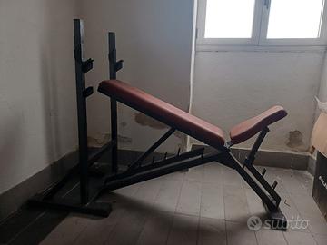 panca professionale con 85 kg di pesi 