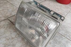 innocenti mini small de Tomaso faro sx nuovo