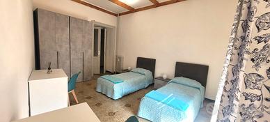 Camera condivisa a studenti universitari