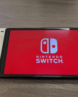 Nintendo Switch OLED Bianca + 2 Giochi + Accessori