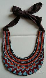 Collana di perline turchesi e arancioni