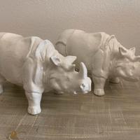 Coppia di Statue di rinoceronte in ceramica.