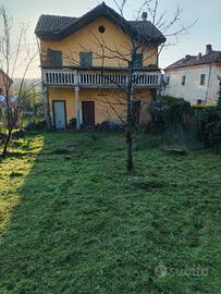 Casa con giardino