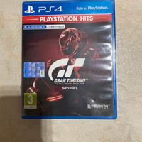 PlayStation + volante + pedalini + gioco.