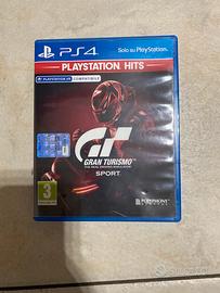 PlayStation + volante + pedalini + gioco.