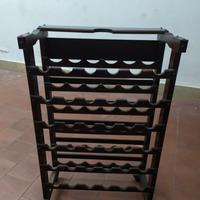 Porta bottiglie in legno.