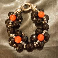 Bracciale gioiello con pietre nere, rosse, strass.