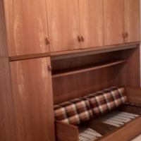 Armadio guardaroba a ponte con divano letto 