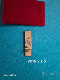 fermasoldi in metallo dorato