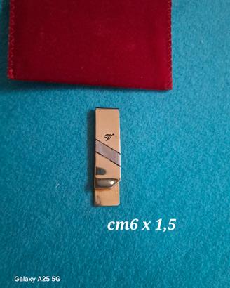 fermasoldi in metallo dorato